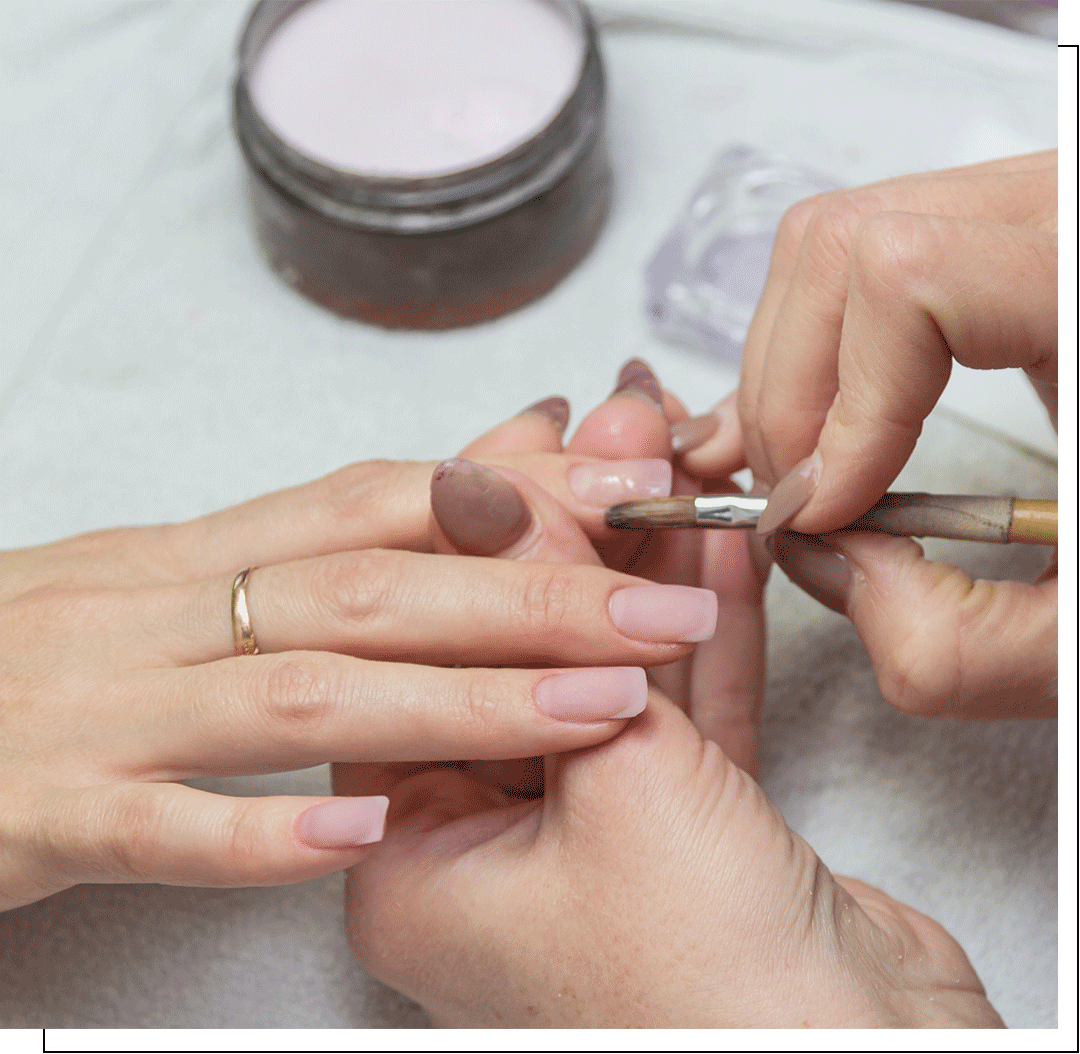 Nail extensions being applied